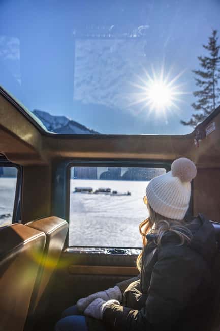Banff: Winter Tour with Dinner & Nightrise at Banff Gondola - Banff Avenue and Bow Falls: the town side of winter