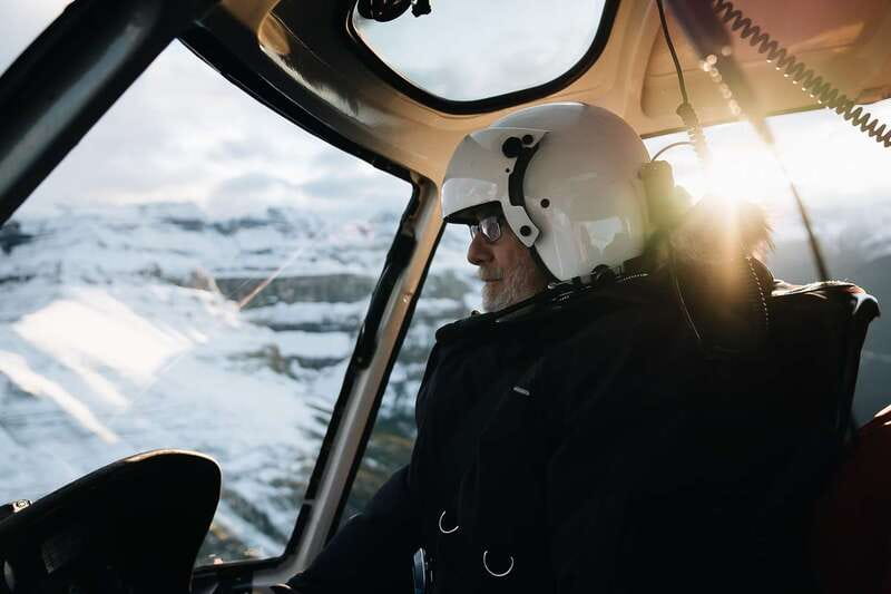 Canadian Rockies: Abraham Lake Ice Bubbles Helicopter Tour - Warming up by the fire: comfort between cold highlights