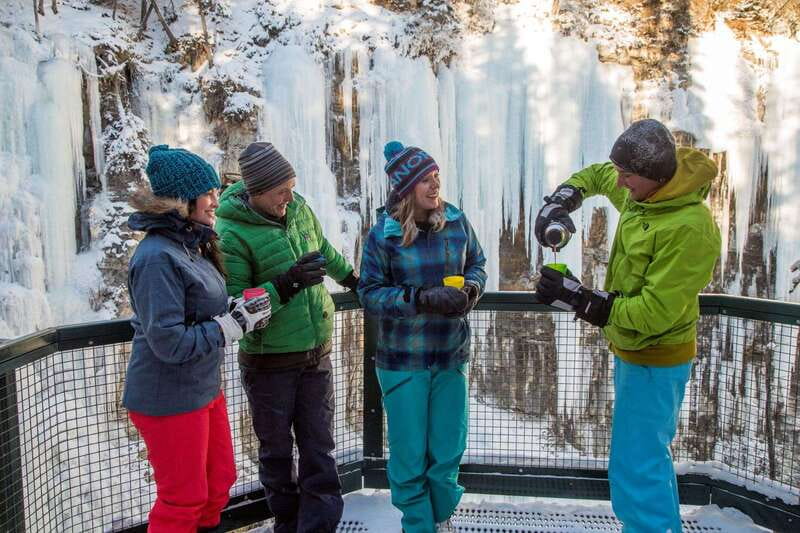 From Banff: Johnston Canyon Guided Icewalk - Lower Falls tunnel and frozen waterfall: the close-up payoff
